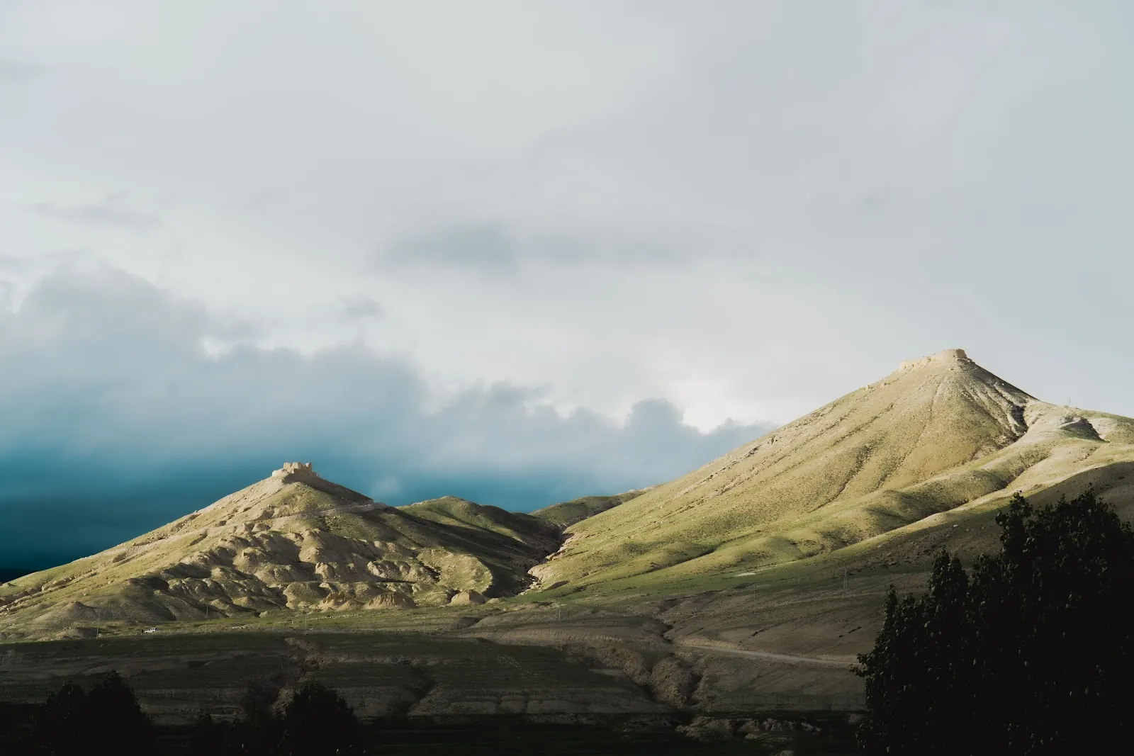 Green hills under passing cloud
